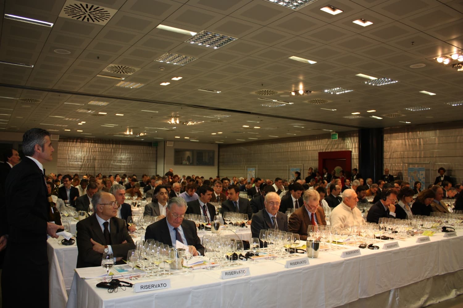 Wine competition judges evaluating wines at a tasting panel